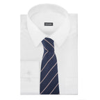 Navy striped tie with pink stripe, shown on folded white shirt
