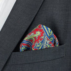 Colorful paisley pocket square in a dark gray suit pocket