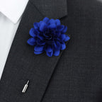 Blue lapel pin flower on grey suit