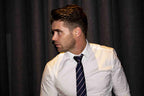 Man wearing navy and pink striped tie 