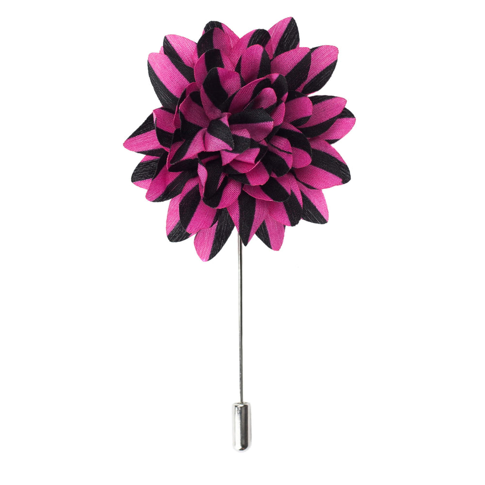 Floral lapel pin with pink and black petals on a white background