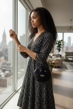 Muse wonky eye chain black-white cow handbag