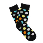 Black socks with colorful polka dot pattern on a white background