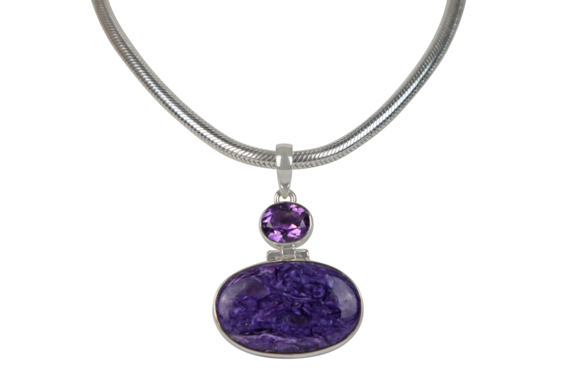 Very beautiful purple colour Oval cut Chorite pendant sitting horizontally with a very beautiful faceted Amethyst Main image