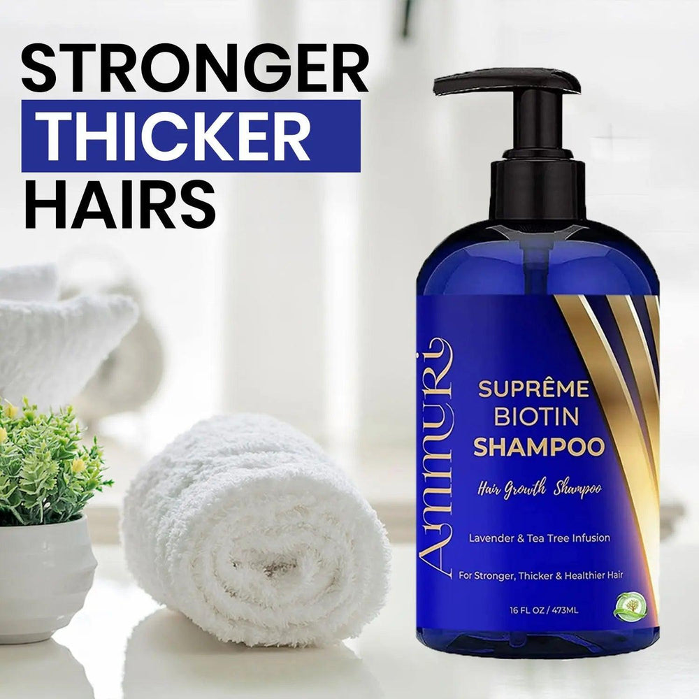 Ammuri Skincare Supreme Biotin Shampoo bottle for hair growth beside rolled white towel and small green plant biotin shampoo for thicker hair