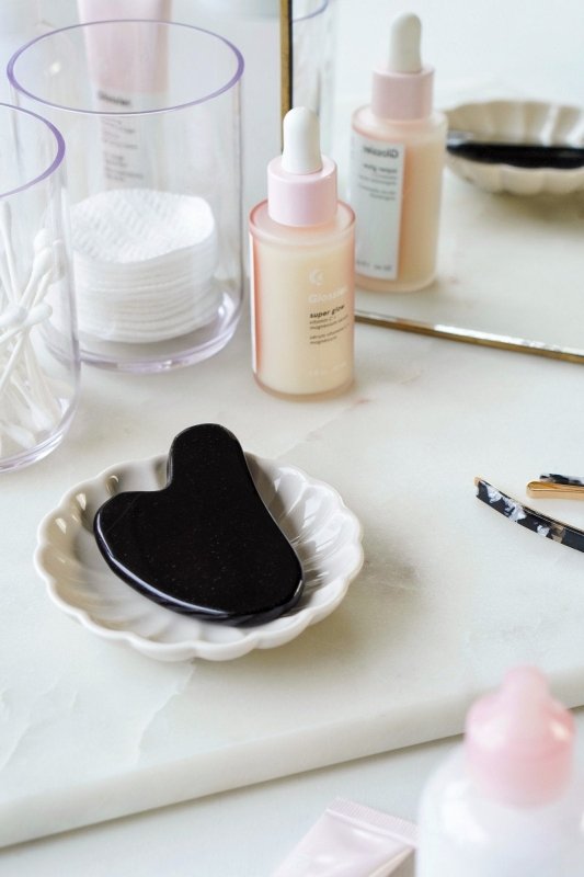 Black Obsidian Crystal Gua Sha with Black Skull Pouch - Cosmetic Tools - British D'sire Main image