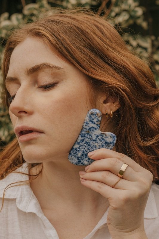 Xander Kostroma Blue Vein Stone Crystal Gua Sha | Facial Massage Tool 4.5” | Black Skull Pouch Included | Skin Rejuvenation & Tension Relief | Natural Stone Beauty Ritual Secondary image