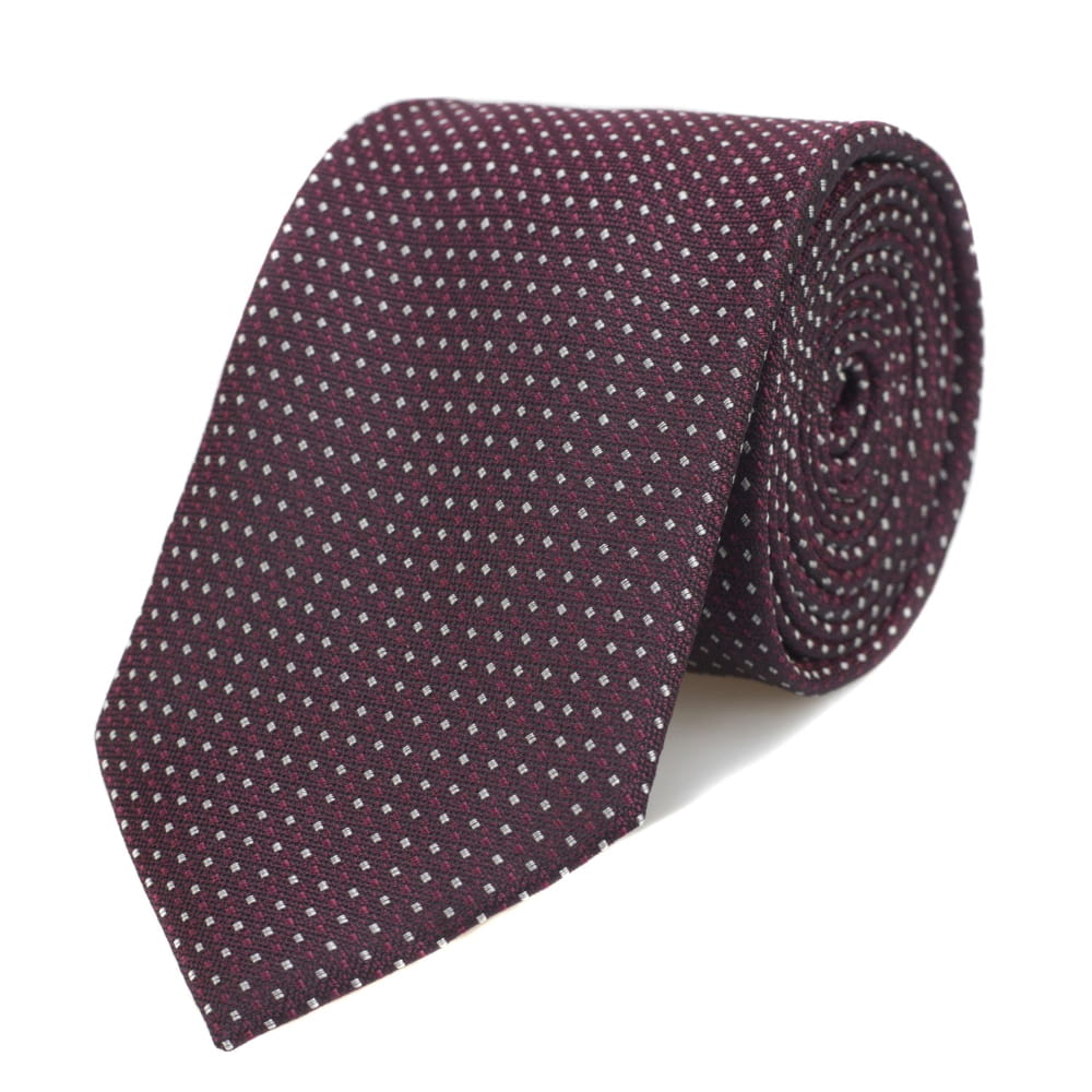 Burgundy tie against white backdrop