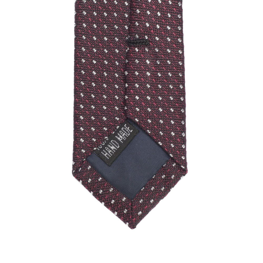 Burgundy tie with handmade tag showing