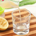 Multi - function Manual Mini Lemon Juicer with a Graduation Cup Juicer (Random Color Delivery) - British D'sire