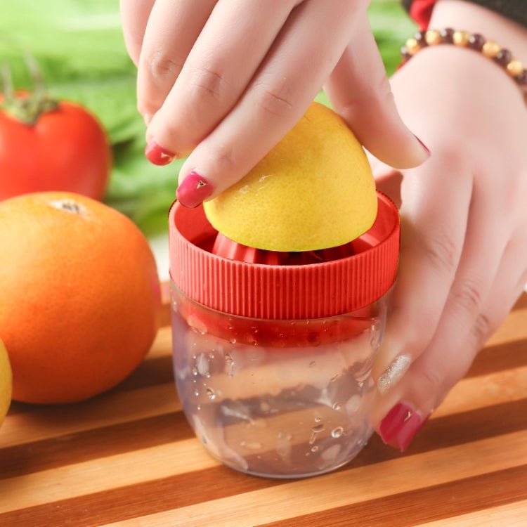Multi - function Manual Mini Lemon Juicer with a Graduation Cup Juicer (Random Color Delivery) - British D'sire