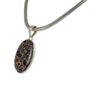 A simple Oval Shaped Turtella Agate Set on Sterling Silver Open Back bazel - Necklaces & Pendants - British D'sire