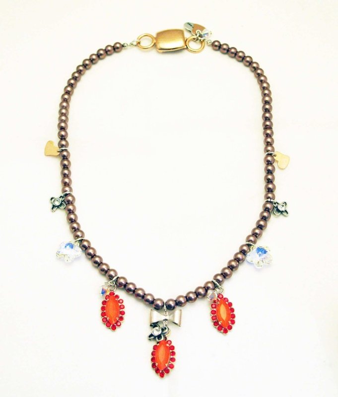 Beaded necklace with orange rhinestones, silver plated brass and small charms. - Necklaces - British D'sire