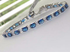 Jewellery Kingdom Oval Tennis Cubic Zirconia Rhodium Ladies Sapphire Bracelet (Silver) - Bracelets & Bangles - British D'sire