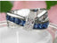 Jewellery Kingdom Sapphire Crossover Princess Cut CZ Stainless Steel Ladies All Size Ring (Blue) - Jewelry Rings - British D'sire